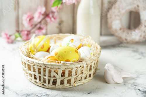 Decorated Easter eggs in the basket photo