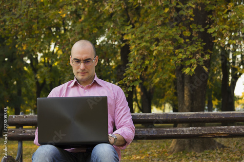 Young man work in park