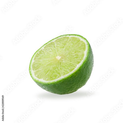 Half with slice of fresh green lime isolated on white background
