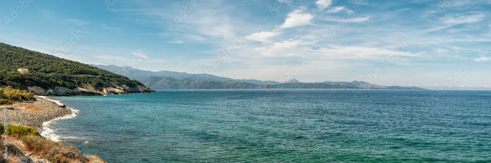 Coastline and pebble beach at Farinole in Corsica Coastline and pebble beach at Farinole in Corsica