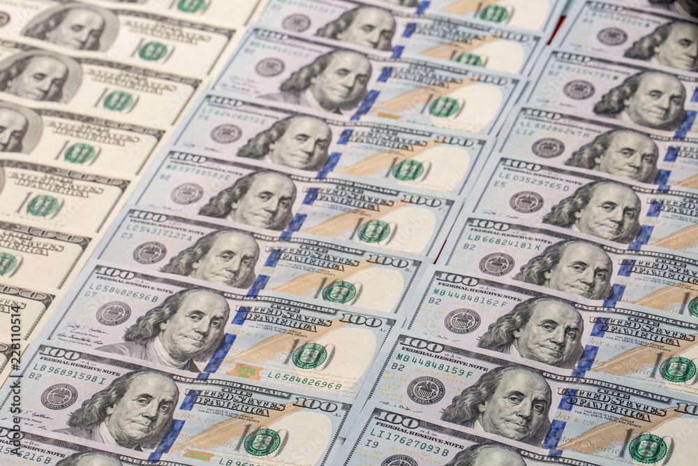a pile of American paper hundred-dollar bills as an element of the world financial system a pile of American paper hundred-dollar bills as an element of the world financial system
