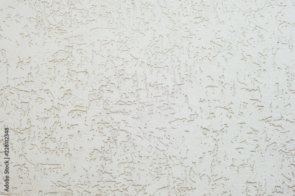 Texture of decorative plaster with a relief. White plaster Close-up. Texture of decorative plaster with a relief. White plaster Close-up.