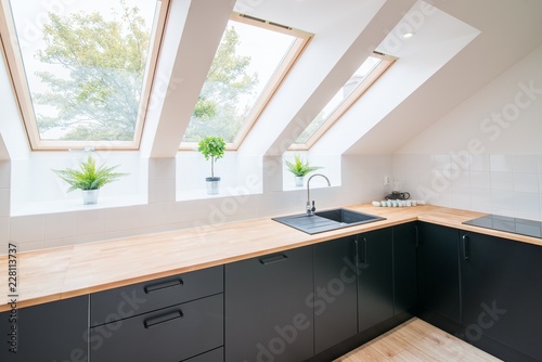 Bright kitchen with slanted ceiling.