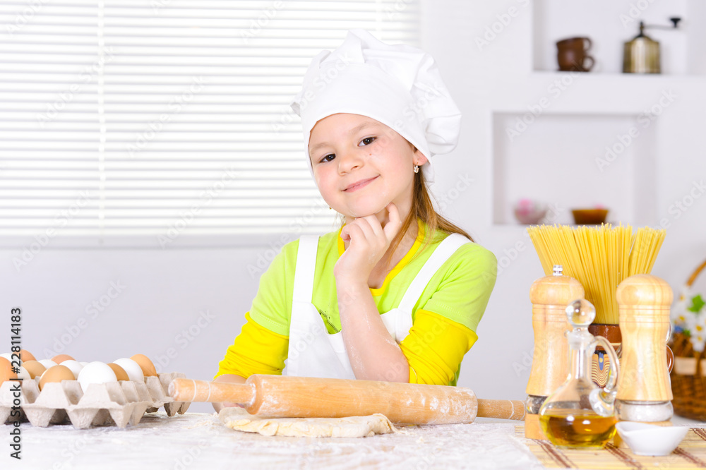Cute girl baking cake in the kitchen Cute girl baking cake in the kitchen
