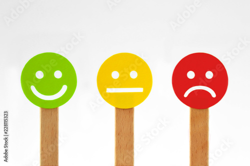 Green, yellow and red smiley faces with positive, neutral and negative expression photo