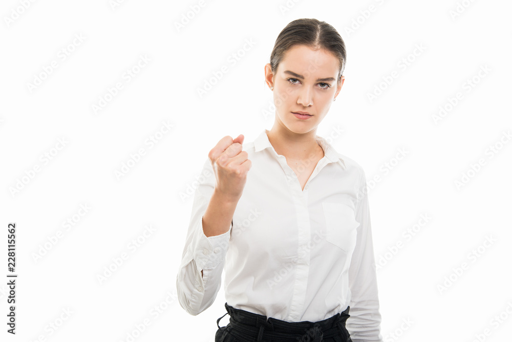 Young pretty bussines woman showing angry fist gesture Young pretty bussines woman showing angry fist gesture
