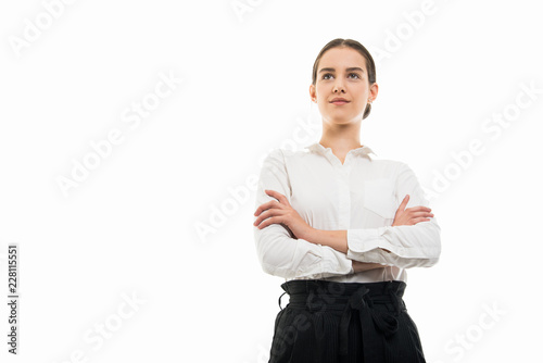 Low angle of young bussines woman standing with arms crossed photo