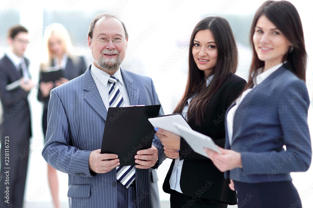 boss and employees on blurred background office. boss and employees on blurred background office.