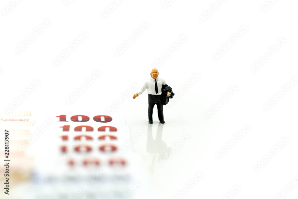 Miniature people : Businessman standing with money,financial concept and more buy power.