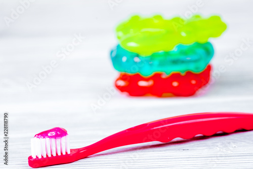 children s toothbrush oral care on wooden background