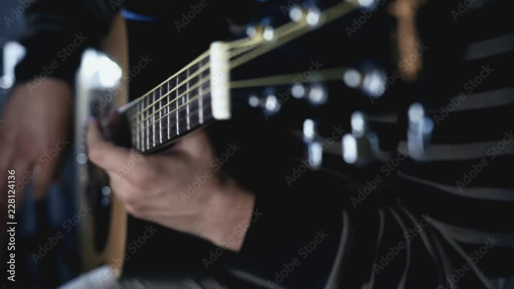 Guitarist musician playing on acoustic guitar. Guitarist plays music. Playing guitar music Guitarist musician playing on acoustic guitar. Guitarist plays music. Playing guitar music