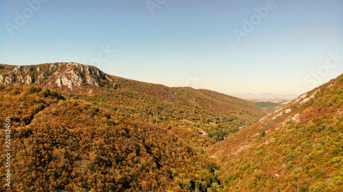 Aerial view of mountains in national park Cheile Nerei Beusnita in Romania. Part of Carpathian mountains with beautiful autumn colors.