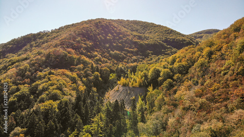 Aerial view of mountains in national park Cheile Nerei Beusnita in Romania. Part of Carpathian mountains with beautiful autumn colors.