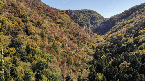 Aerial view of mountains in national park Cheile Nerei Beusnita in Romania. Part of Carpathian mountains with beautiful autumn colors.