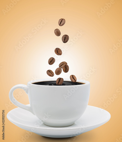 coffee beans falling into cup