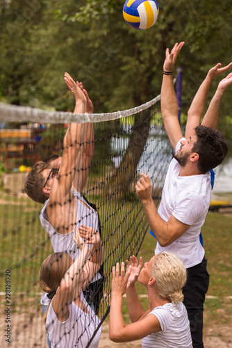 group of young friends playing Beach volleyball © .shock