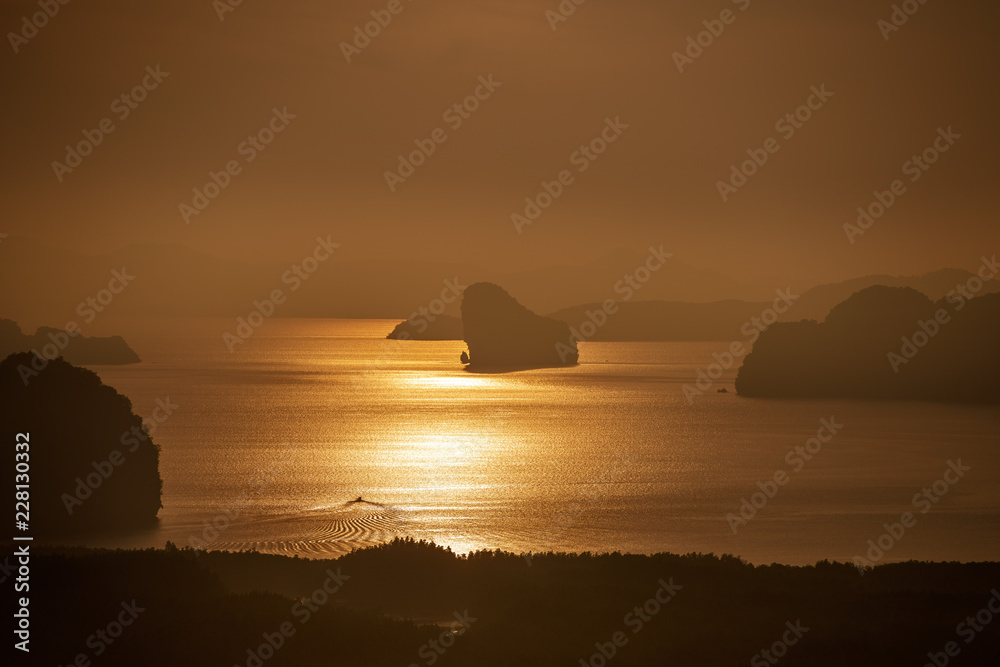 Sunrise landscape with sea, boats and islands