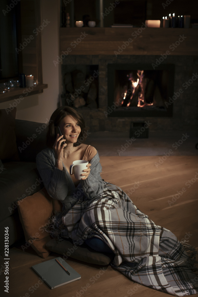 A Woman Enjoying Wintertime and Talking on Cell Phone A Woman Enjoying Wintertime and Talking on Cell Phone