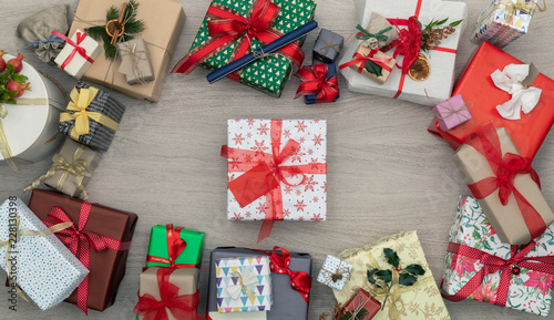 Gift present box in vertical top view wooden table full of christmas or birthday gifts presents.Xmas winter holiday season party social media card background,portrait story