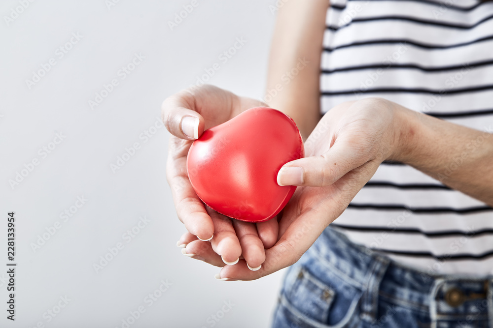 Red heart shape in the hands Red heart shape in the hands