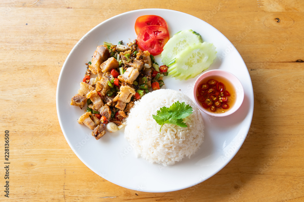 Fried crispy pork with rice.