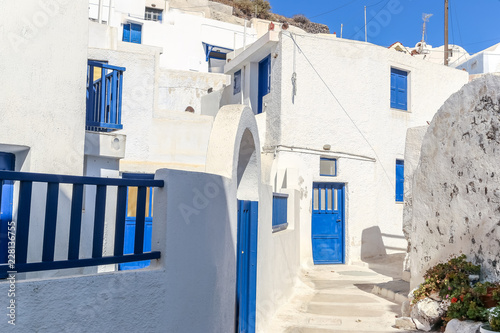 Beautiful street with blue doors of Akrotiri in Santorini © matiplanas