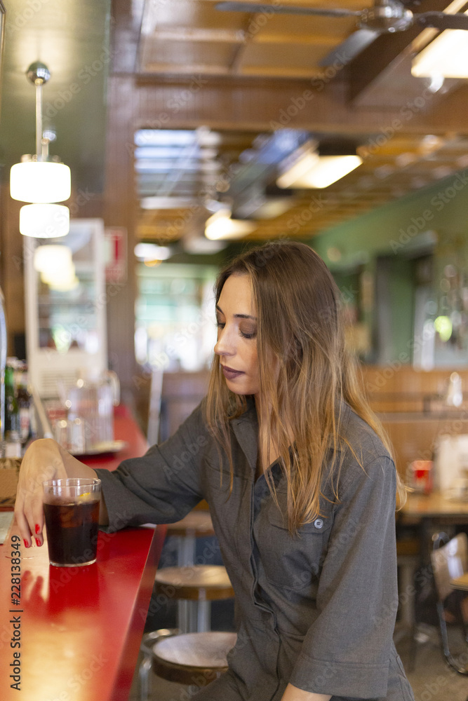 Cheerful woman sitting in cafe Cheerful woman sitting in cafe
