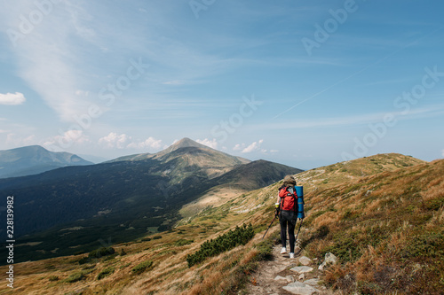 woman goes hiking with a backpack, mountains, nature, travel © Victoriya Bulyha