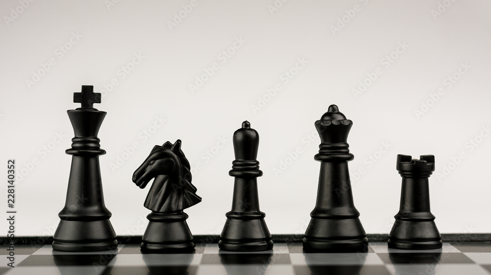 Black chess figures on board.- business idea for competition. - Success and Leadership concept Black chess figures on board.- business idea for competition. - Success and Leadership concept