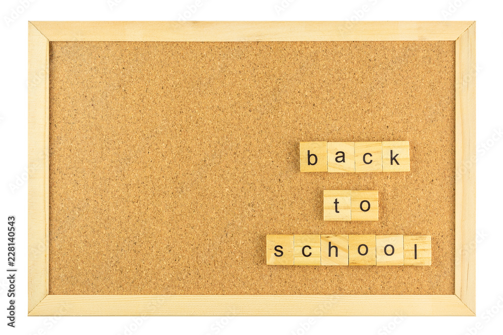 Back to school word on cork board in wooden frame isolated on white background.