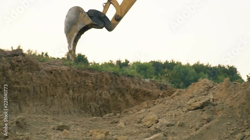 excavator loads a truck
