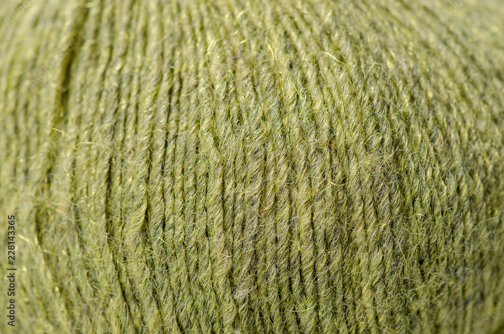 Green wool thread macro texture material blur background Green wool thread macro texture material blur background