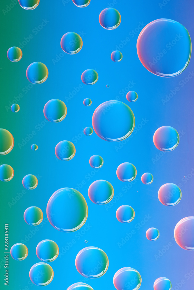 close-up view of beautiful calm transparent water drops on abstract background