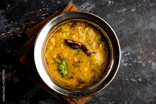 Obraz na plátne Dal Tadka Fry / Indian Lentil Curry served in a bowl with rice and roti, selecti
