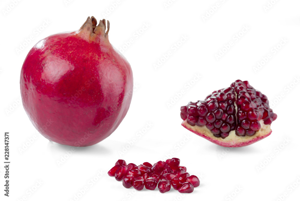 Pomegranate, whole, piece and grain isolated on white. Selective focus. Pomegranate, whole, piece and grain isolated on white. Selective focus.