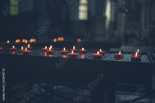 Votice candles in a church photo