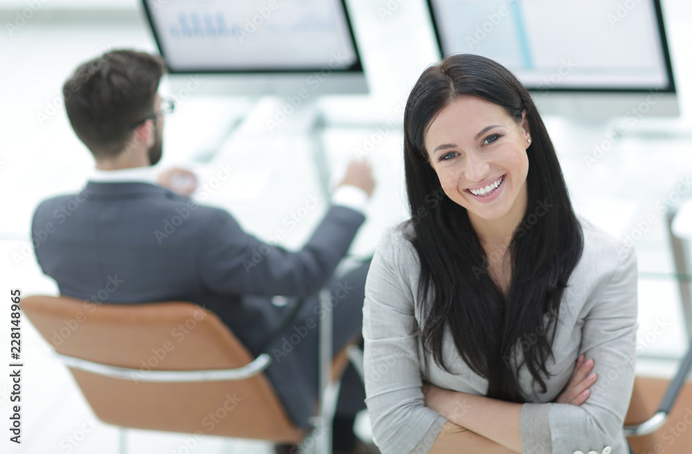 successful business woman on the background of a modern workplace successful business woman on the background of a modern workplace