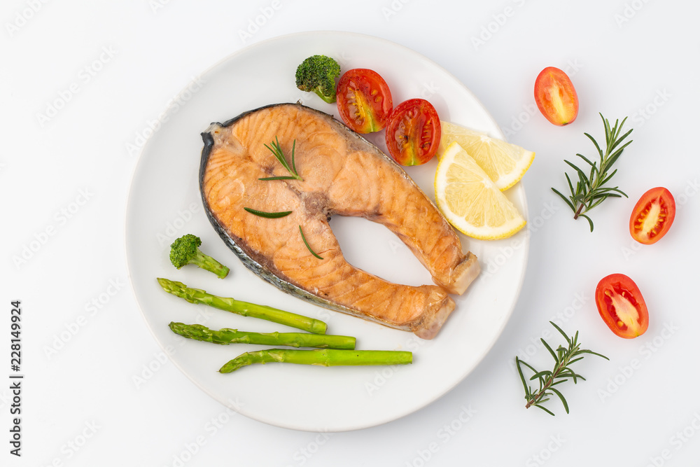 Salmon Grilled on a white plate isolated on white background. Salmon Grilled on a white plate isolated on white background.