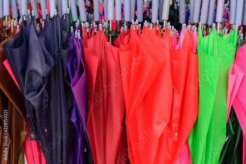 storage of different colors umbrella.Colorful umbrellas background.