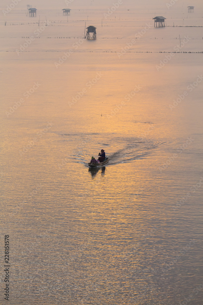 Beautiful Sunrise in morning with Fishing boat at Bangtaboon , petchaburi thailand Beautiful Sunrise in morning with Fishing boat at Bangtaboon , petchaburi thailand