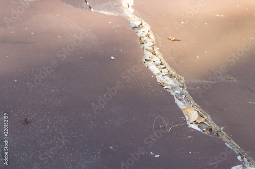 Broken brown tile floor