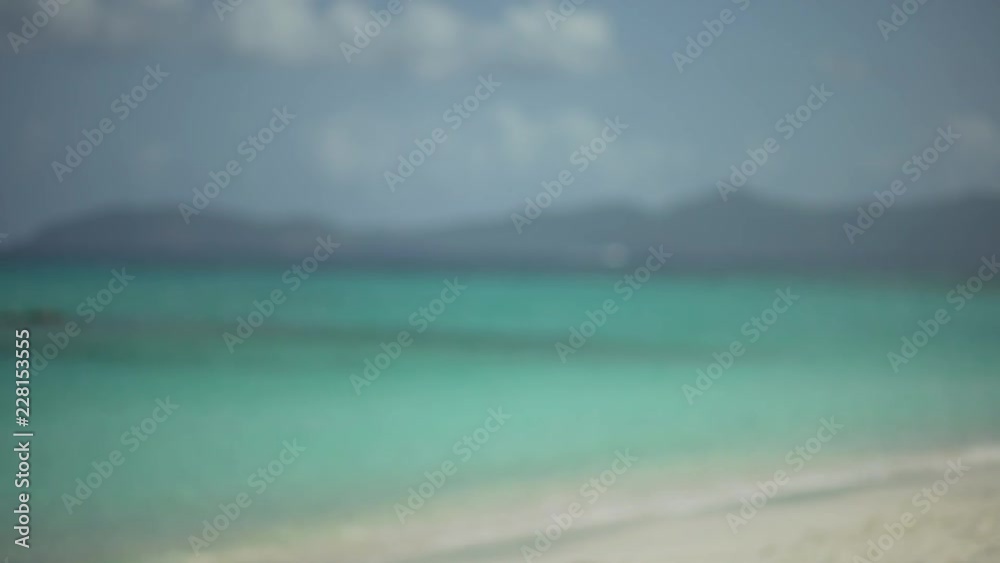 Background Plate of Out of focus Caribbean ocean with an island for green screen Background Plate of Out of focus Caribbean ocean with an island for green screen