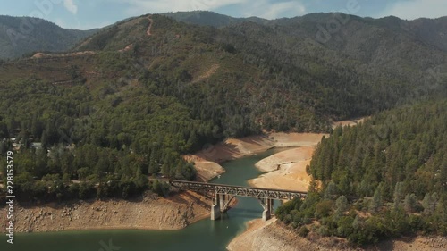 Aerial view of bridge over Shasta Lake in Northern California low water levels during drought photo