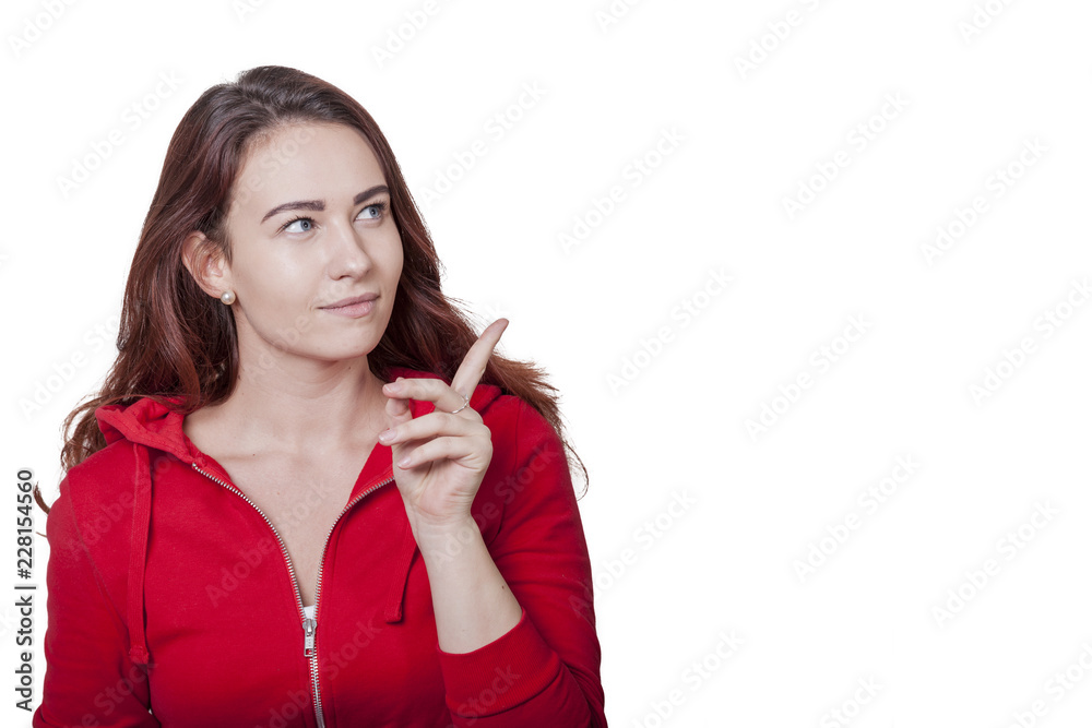 young woman in red shirt showing index finger looking to the top side young woman in red shirt showing index finger looking to the top side