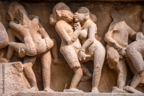 Close up erotic stone carving in Lakshman Temple photo