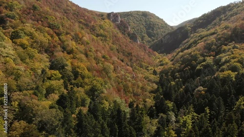 Aerial view of mountains in national park Cheile Nerei Beusnita in Romania. Part of Carpathian mountains with beautiful autumn colors.