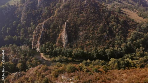 Aerial view of mountains in national park Cheile Nerei Beusnita in Romania. Part of Carpathian mountains with beautiful autumn colors.