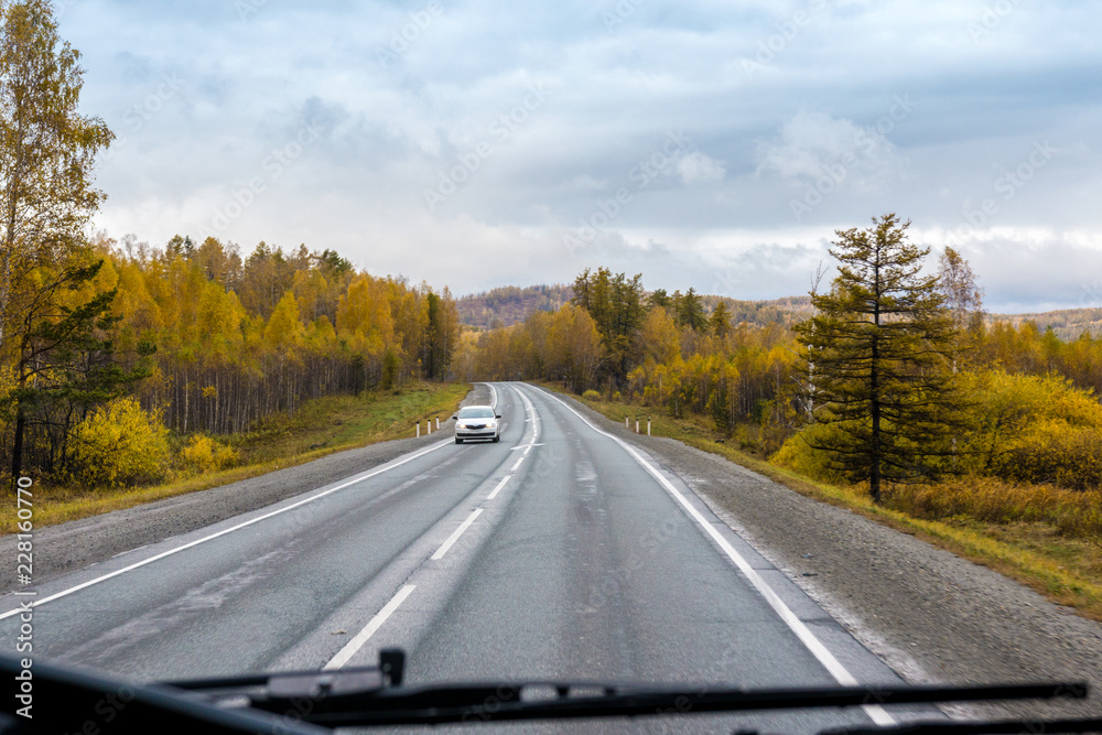 autumn view of the highway from the cab