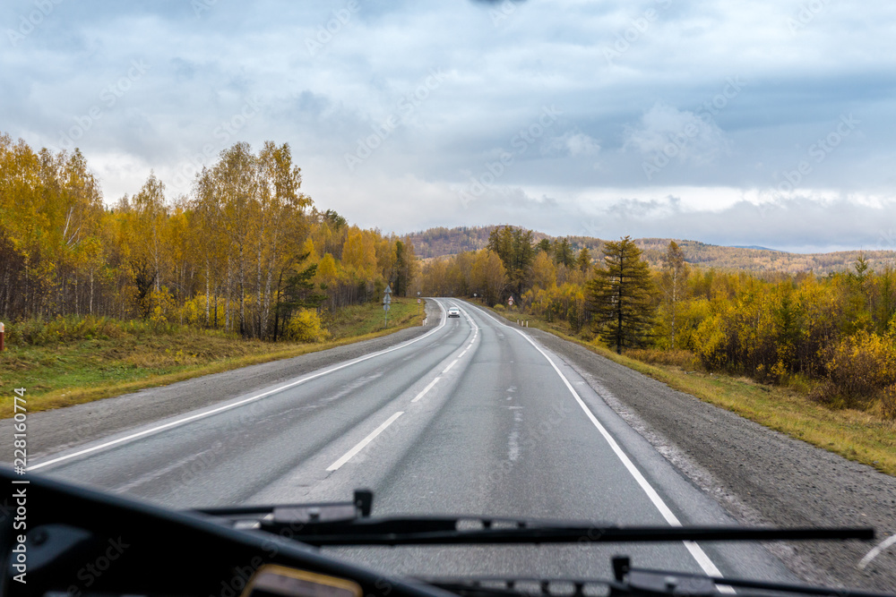 autumn view of the highway from the cab