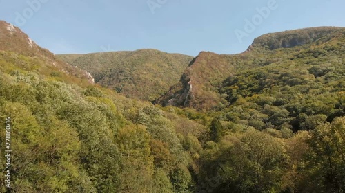 Aerial view of mountains in national park Cheile Nerei Beusnita in Romania. Part of Carpathian mountains with beautiful autumn colors.